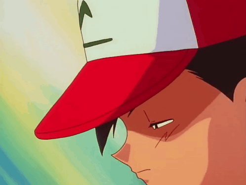 a close up of a person wearing a red hat with a pokemon on it