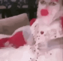 A Close Up Of A Person Wearing A Santa Claus Costume GIF