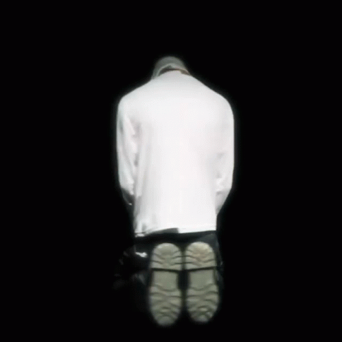 A Close Up Of A Person Wearing A Shirt That Says Killer On It . GIF