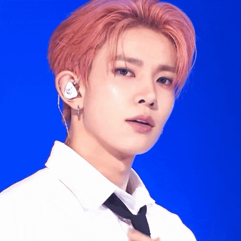 A Close Up Of A Person Wearing A White Shirt And Tie GIF
