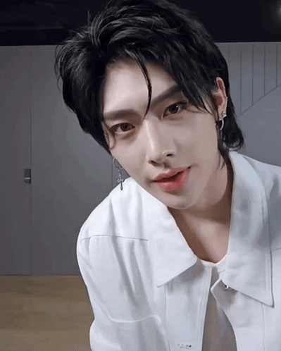 A Close Up Of A Person Wearing A White Shirt GIF