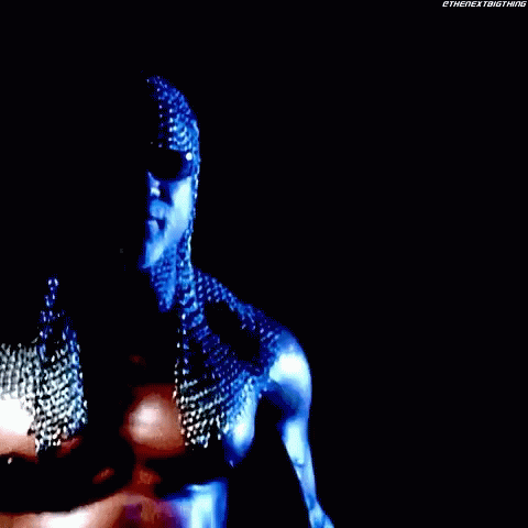 A Close Up Of A Person Wearing Chain Mail And Sunglasses . GIF