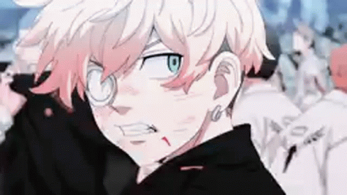 A Close Up Of A Person Wearing Glasses And A Black Jacket In A Crowd . GIF