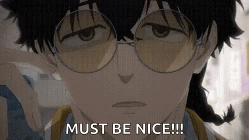 A Close Up Of A Person Wearing Glasses And A Braid . GIF