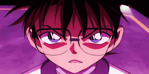 A Close Up Of A Person Wearing Glasses And A White Shirt GIF