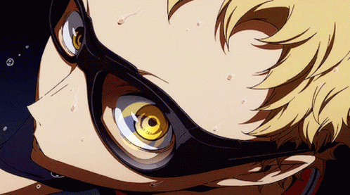 A Close Up Of A Person Wearing Glasses With A Yellow Eye GIF