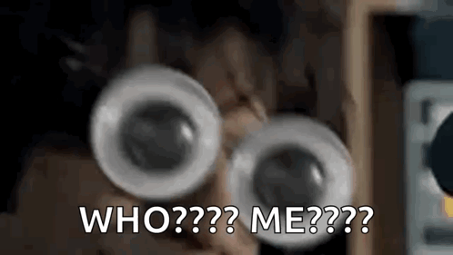 A Close Up Of A Person Wearing Googly Eyes And Asking Who Me . GIF