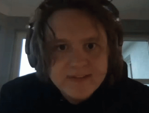 A Close Up Of A Person Wearing Headphones GIF