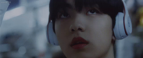 A Close Up Of A Person Wearing Headphones With The Letters Sd On The Bottom Right GIF