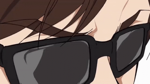 A Close Up Of A Person Wearing Sunglasses Against A White Background GIF