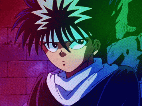 A Close Up Of A Person With A Rainbow Background GIF