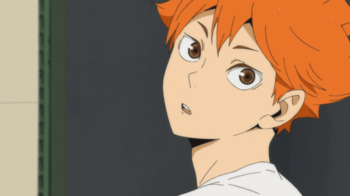 A Close Up Of A Person With Orange Hair And Brown Eyes GIF