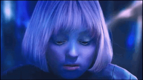 A Close Up Of A Person With Purple Hair GIF