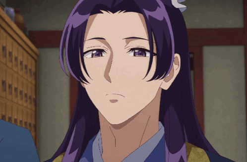 a close up of a person with purple hair and blue eyes