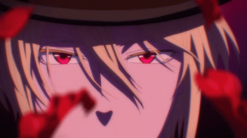 A Close Up Of A Person With Red Eyes And A Hat GIF