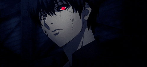 A Close Up Of A Person With Red Eyes In The Dark GIF