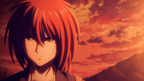 A Close Up Of A Person With Red Hair And A Sunset In The Background GIF