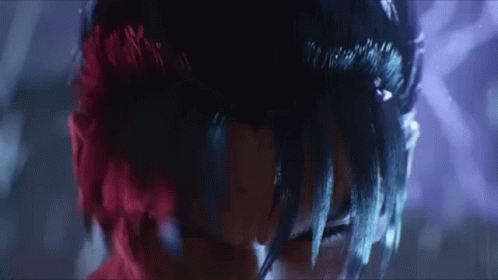 A Close Up Of A Person With Red Hair And Black Hair GIF