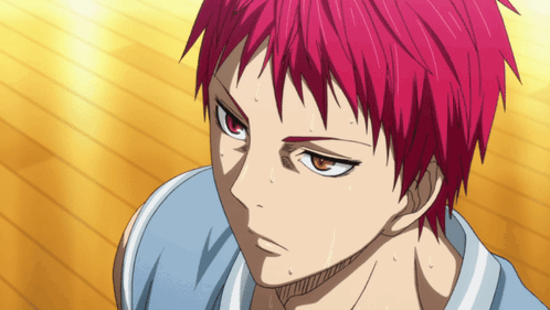 A Close Up Of A Person With Red Hair And Orange Eyes GIF