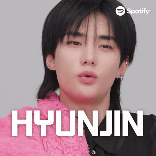 A Close Up Of A Person With The Name Hyunjin On The Bottom GIF