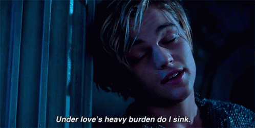 A Close Up Of A Person With The Words Under Love 'S Heavy Burden Do I Sink GIF