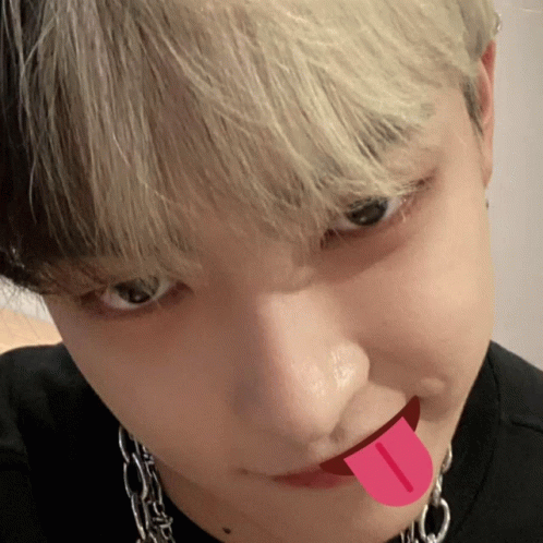 A Close Up Of A Person With Their Tongue Out GIF