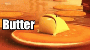 A Close Up Of A Piece Of Butter On A Pancake GIF