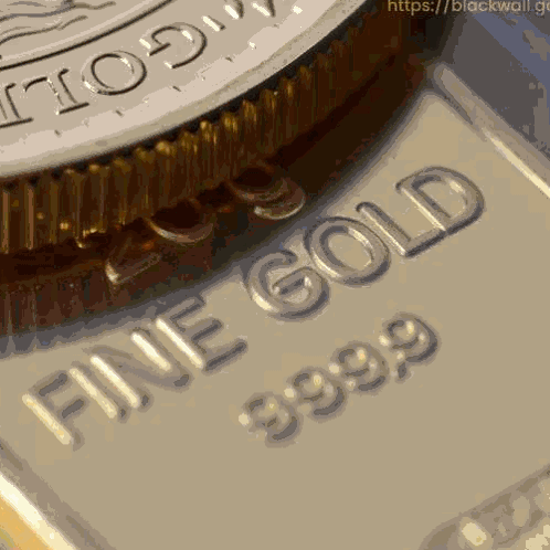 A Close Up Of A Piece Of Gold That Says Fine Gold 39.99 GIF