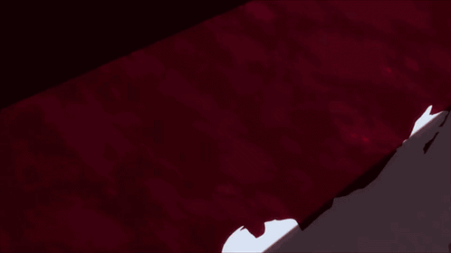 A Close Up Of A Piece Of White Paper On A Red Surface GIF