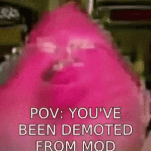 A Close Up Of A Pink Candy Bar With The Words `` Pov : You 'Ve Been Demoted From Mod '' Written On It . GIF
