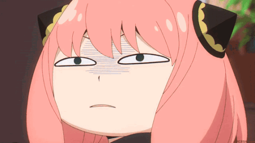 A Close Up Of A Pink Haired Anime Girl Making A Funny Face GIF