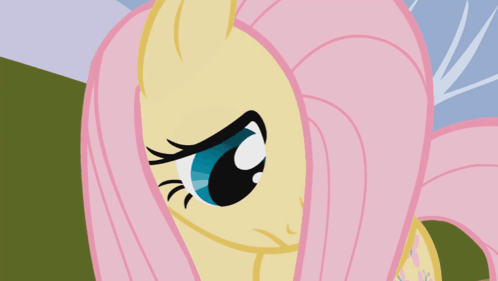 A Close Up Of A Pony 'S Face With Pink Hair GIF
