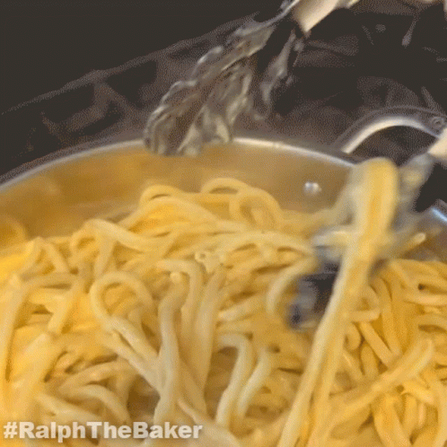 A Close Up Of A Pot Of Noodles With The Hashtag #Ralphthebaker Visible GIF