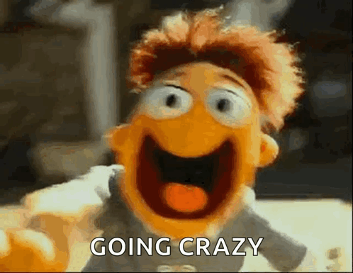A Close Up Of A Puppet With Its Mouth Open And The Words `` Going Crazy '' Written Above It . GIF