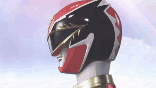 A Close Up Of A Red And Black Power Ranger 'S Helmet . GIF