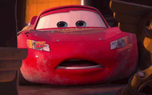 A Close Up Of A Red Car With The Number 95 On The Front GIF
