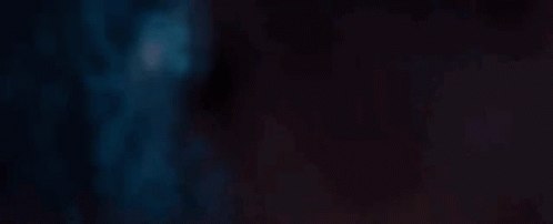 A Close Up Of A Red Light Beam On A Dark Background . GIF