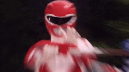 A Close Up Of A Red Power Ranger Making A Funny Face . GIF
