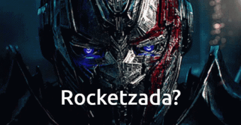 a close up of a robot face with the words rocketzada written below it