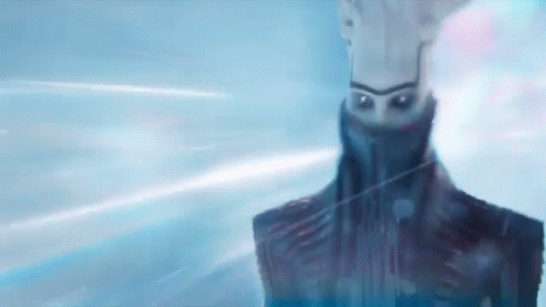 A Close Up Of A Robot 'S Face With A Blue Background And A Light Coming Out Of It . GIF