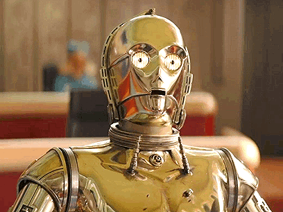 A Close Up Of A Robot 'S Face With A Reflection Of A Man In The Background GIF