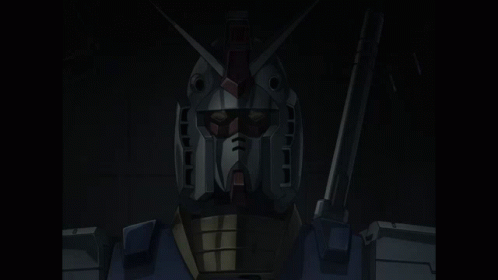 A Close Up Of A Robot 'S Face With Red Eyes And A Gun GIF