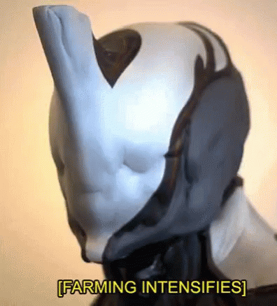 A Close Up Of A Robot 'S Head With The Words `` Farming Intensifies '' Written Below It . GIF