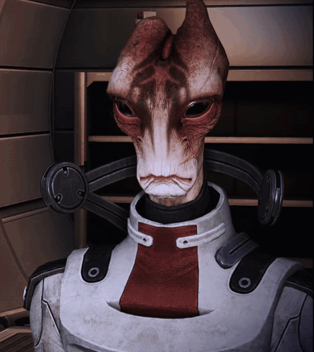 A Close Up Of A Robot With A Red And White Stripe On His Chest GIF