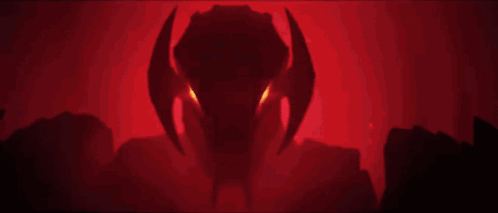 A Close Up Of A Robot With Red Eyes And Horns . GIF