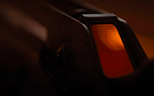 A Close Up Of A Rocket With A Yellow Light In The Background GIF