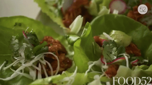 A Close Up Of A Salad With The Words Food52 On It GIF