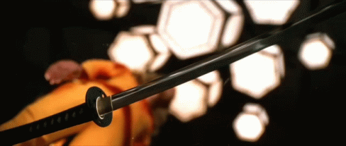 A Close Up Of A Samurai Sword With The Letter C On It GIF