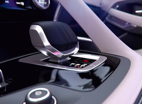 A Close Up Of A Shifter In A Car With The Word Max On The Bottom GIF