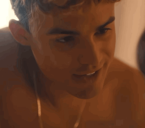 A Close Up Of A Shirtless Man 'S Face Smiling GIF